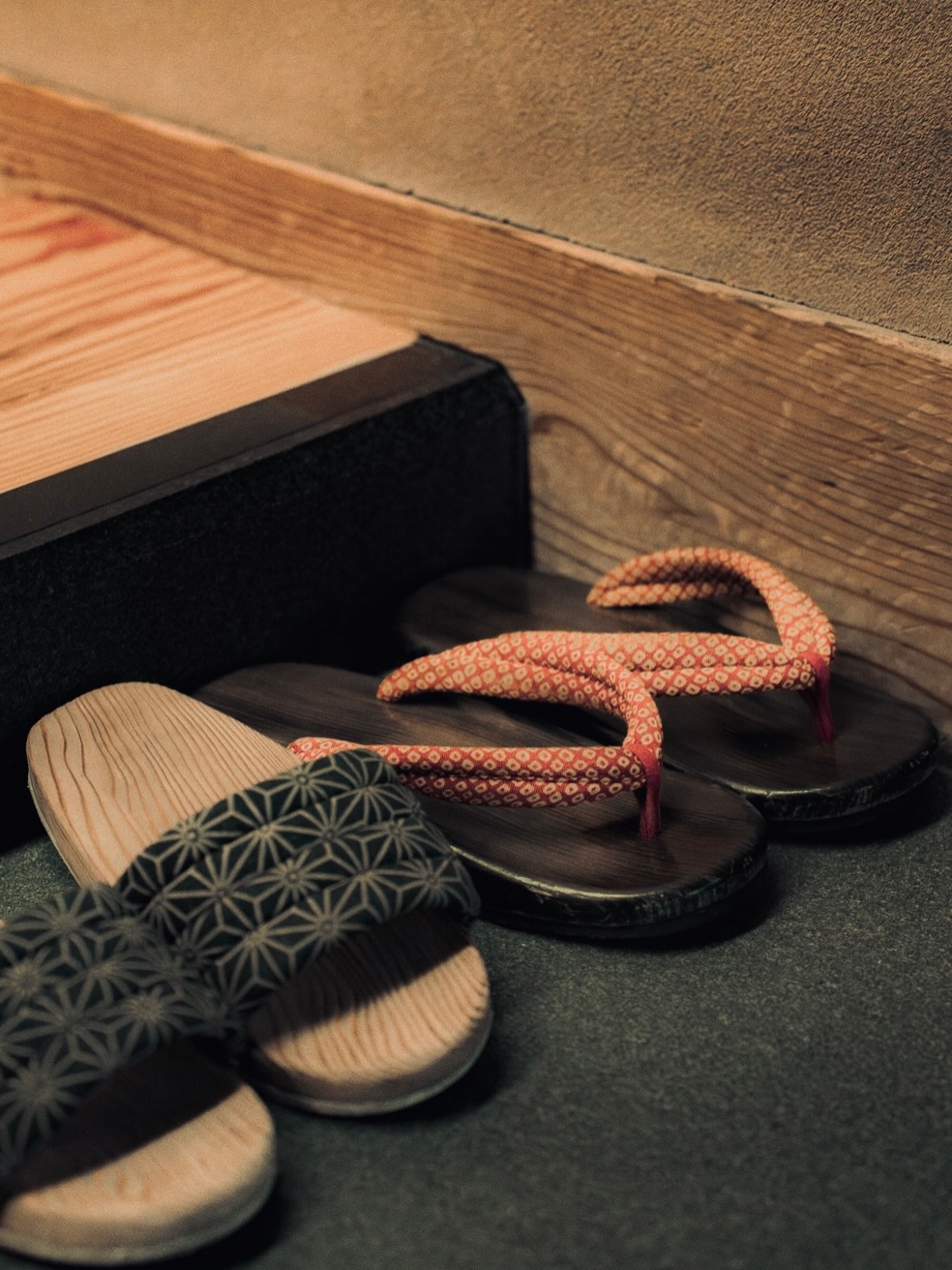 Temple interior in Kyoto, long shadows and a distant procession.